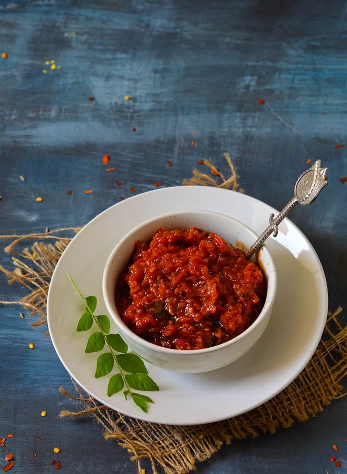 Tangy Twist! Try our Delicious Tomato Pickle (Achar)!  GrosGo delivers flavorful tomato pickle made with fresh, ripe tomatoes and aromatic spices. Perfect for adding a burst of flavor to curries, rice, or as a side dish. Shop now for a taste of authentic Indian pickles!, pickel image